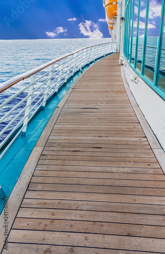 Old Planks on a Curved Deck on Ship between windows and railing © dbvirago