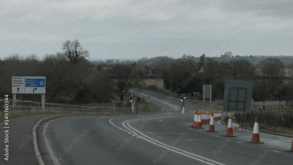 Road junction with no traffic under grey sky. Road junction with no traffic under grey sky.