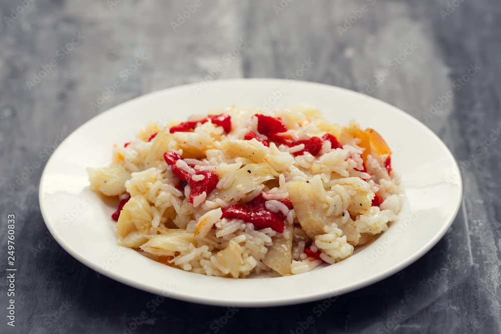 rice with cod fish and red pepper on white plate rice with cod fish and red pepper on white plate