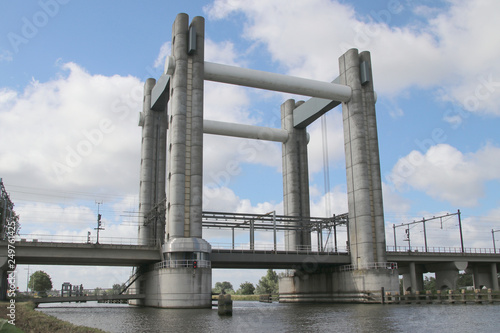 Gouwespoor vertical lifting bridge over canal Gouwe at Gouda for trains in the Netherlands