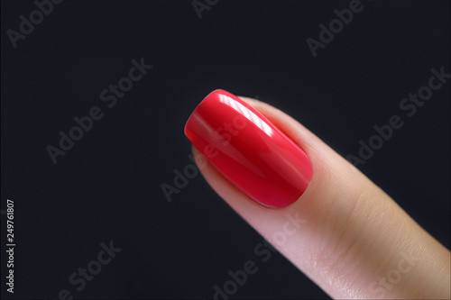 Red Finger nail point isolated black background