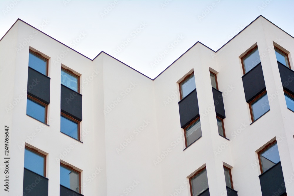 Modern apartment buildings on a sunny day with a blue sky. Facade of a modern apartment building