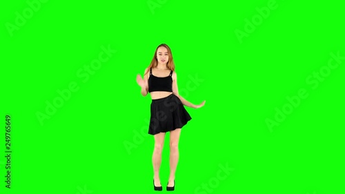 Cute Schoolgirl in Black Skirt Spinnig and Dancing on Green Screen