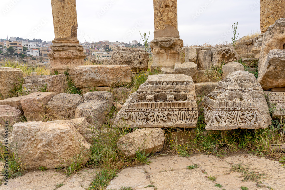 Remnants of columns and friezes in the Roman city of Jerash, Jordan