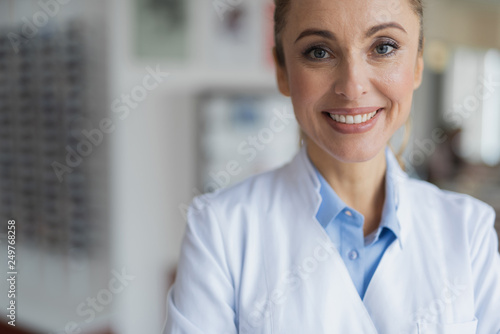 Happy smiling female doctor looking at you