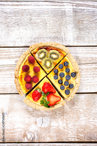 Fruit tarts with sweet fresh berries. Freshly baked cake. Decorated with a berry. Fruit pie. - Image