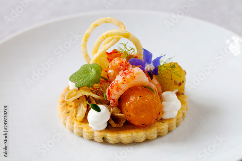 Thyme tart with crayfish, goat cheese mousse and tomato photo