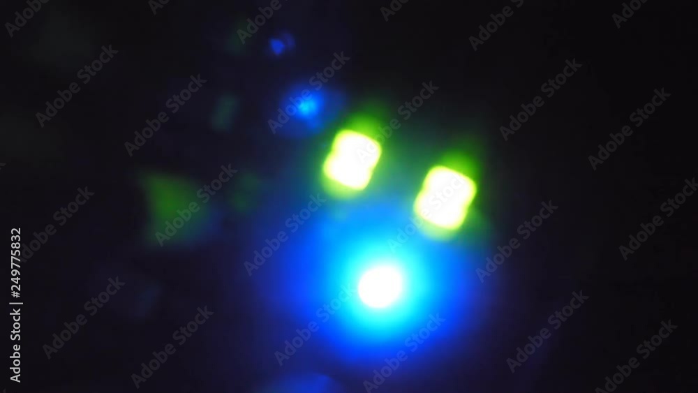 Defocused green and blue LED showing pumping sound levels. Music studio production. Handheld shot with stabilized camera. Defocused green and blue LED showing pumping sound levels. Music studio production. Handheld shot with stabilized camera.