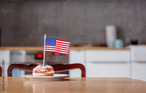 donut with USA flag on white plate