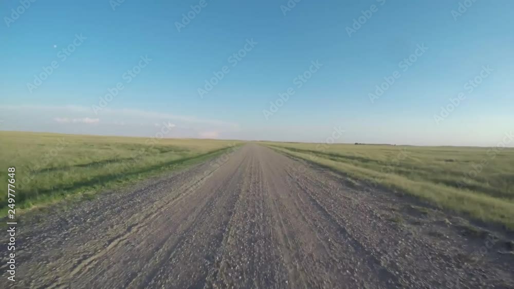 POV driving through a field in the Badlands, South Dakota POV driving through a field in the Badlands, South Dakota