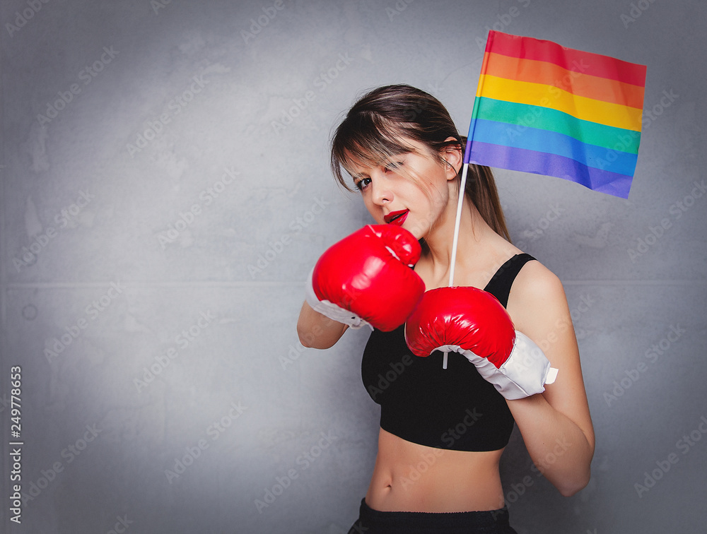 Young woman in boxing gloves with LGBT flag Stock Photo | Adobe Stock