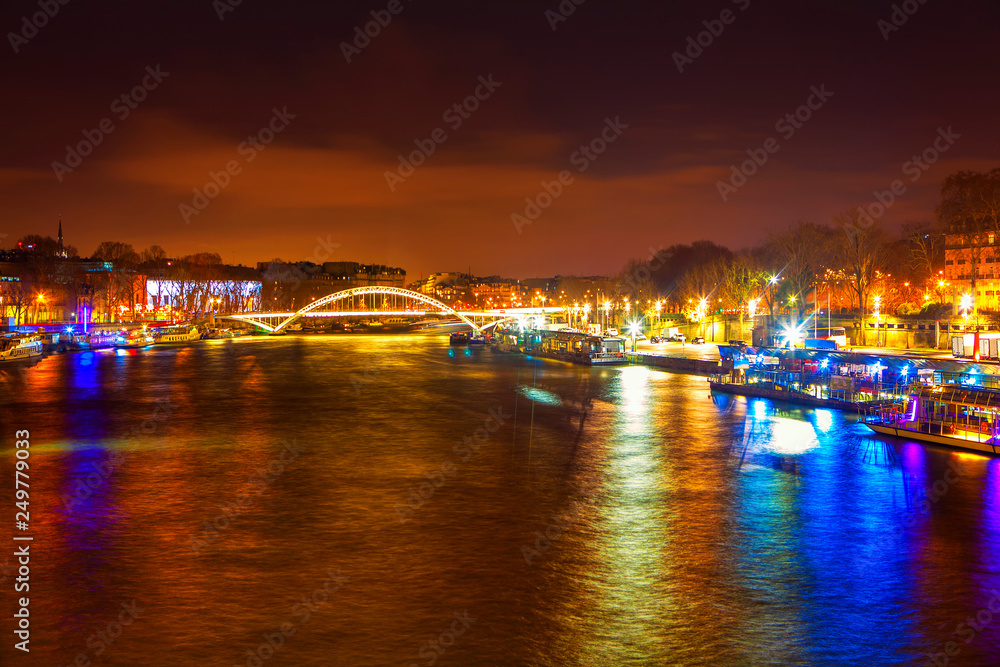 Seine River and bridge at night in Paris 