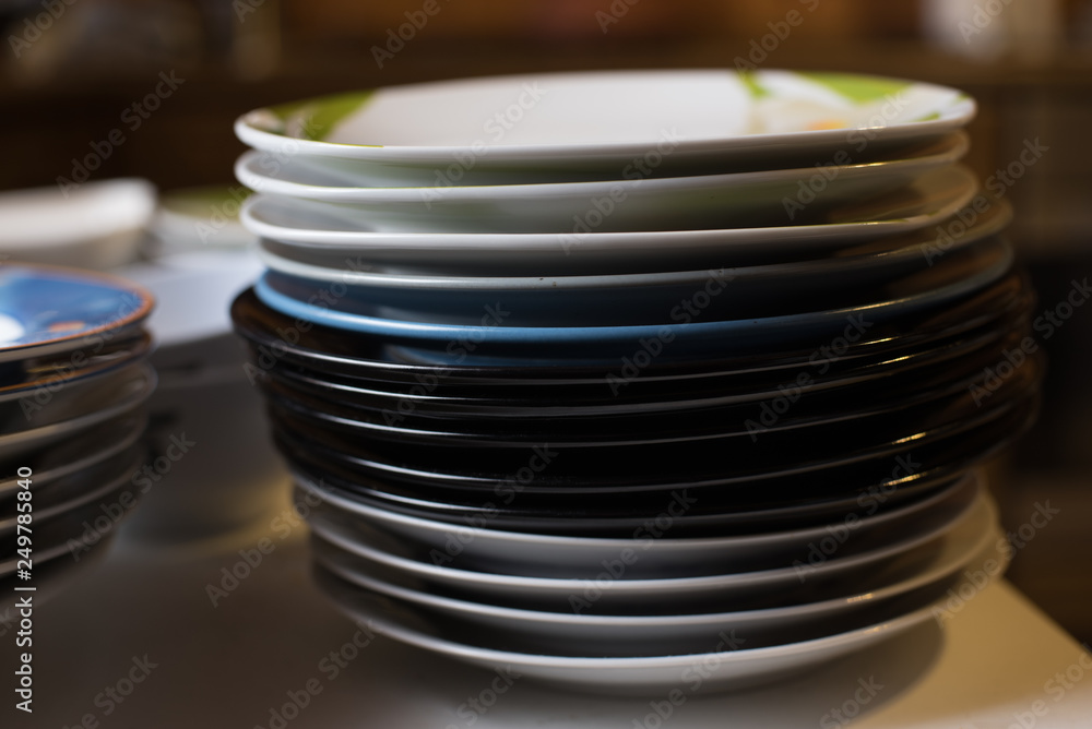 Stack of odd plates in kitchen Stack of odd plates in kitchen