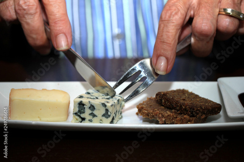 Man eating French cheese