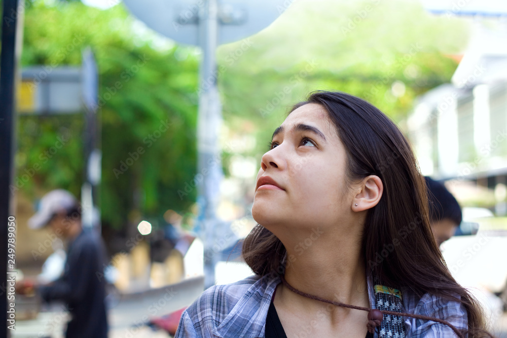 Biracial teen girl tourist along streets of Phnom Pehn, Cambodia Stock ...