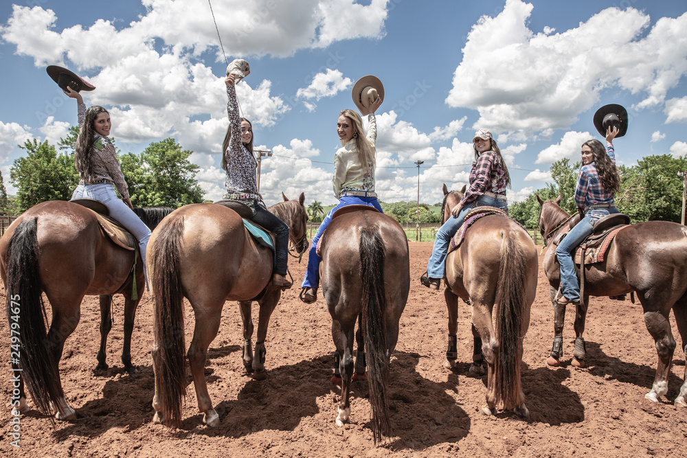 Five young women riding their beautiful horses Five young women riding their beautiful horses