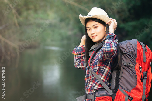 Backpacker woman with nature background