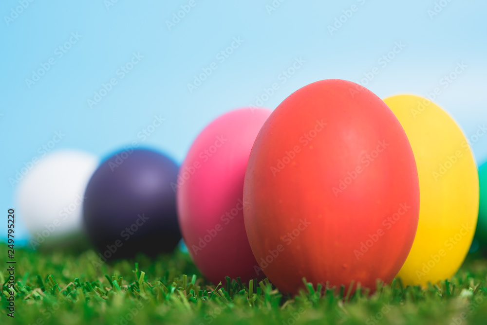Blue Easter eggs clean on grass and pink background Blue Easter eggs clean on grass and pink background