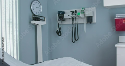 Panning shot of empty medical exam room in hospital or doctors office. Slow motion 4k