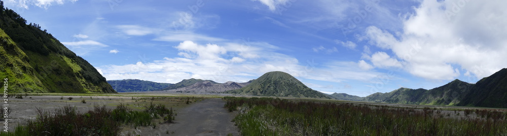 The delightful volcanic complex Bromo Tengger Semeru National Park against the background of fascinating views of nature, sky, craters and clouds