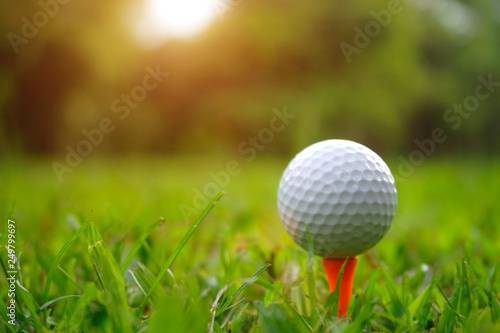 golf ball in beautiful golf course with sunset. Golf ball close up in golf coures at Thailand