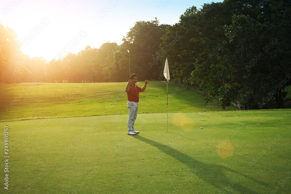 Golfers are putting golf in the evening golf course golf backglound in Thailand Golfers are putting golf in the evening golf course golf backglound in Thailand
