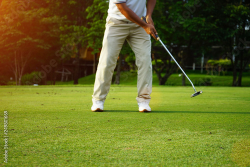 Golfers are putting golf in the evening golf course golf backglound in Thailand photo