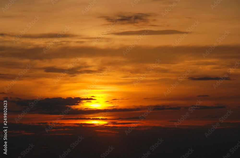 Beautiful sunset with a sun and clouds 