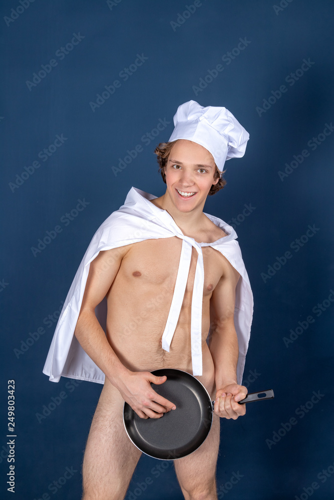 Young sexy chef apron on naked muscular body with pan on blue foto Stock | Adobe Stock