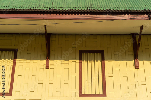 Backgrounds Old wooden windows on the yellow wall