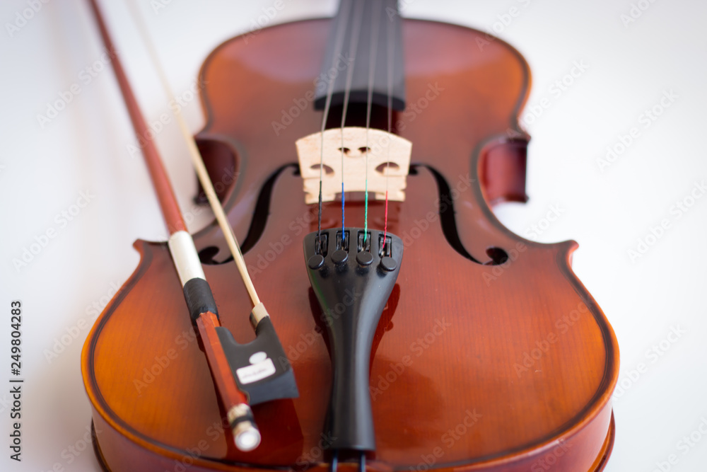 Fototapeta premium Violin in white background with bow