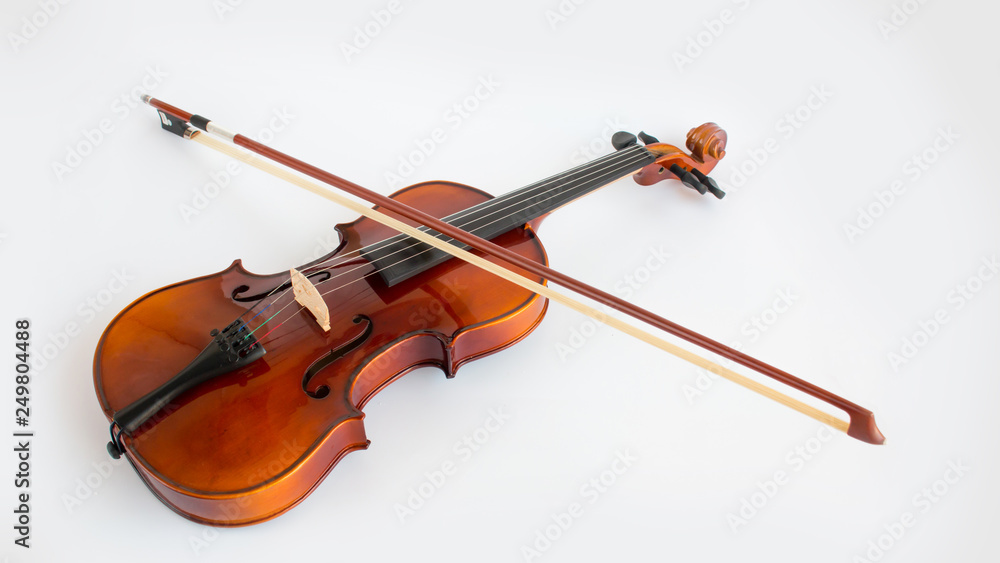 Fototapeta premium Violin in white background with bow