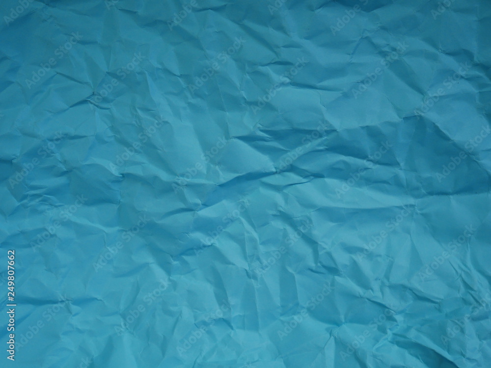 Obraz premium crumpled blue paper background