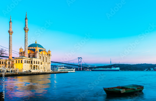 Ortakoy Mosque and Bosphorus Bridge (15th July Martyrs Bridge) sunset view. Istanbul, Turkey..