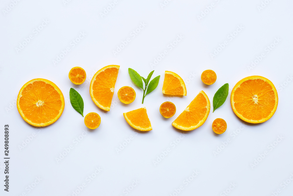 Naklejka premium High vitamin C. Fresh orange citrus fruit with leaves isolated on white.