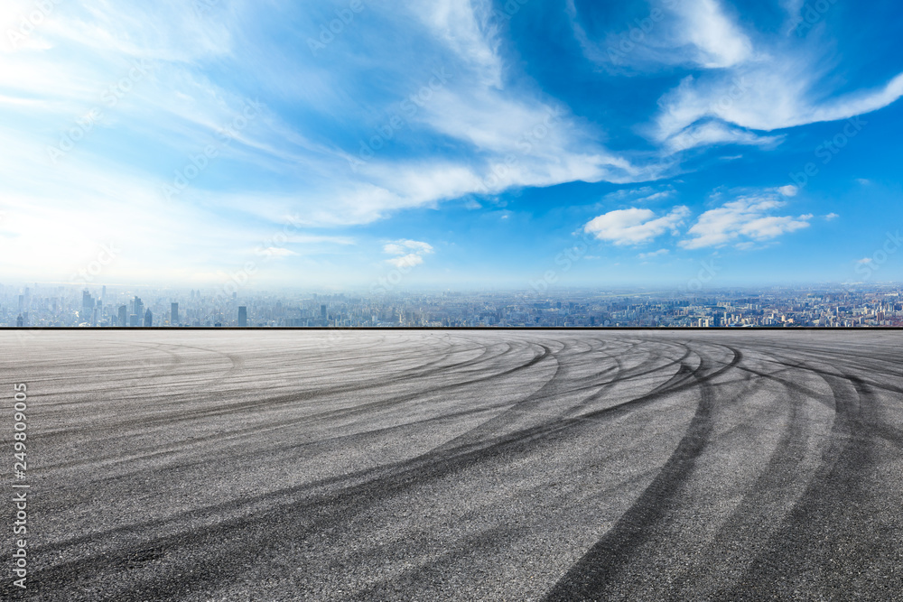 Naklejka premium Empty asphalt road and city skyline in Shanghai,high angle view