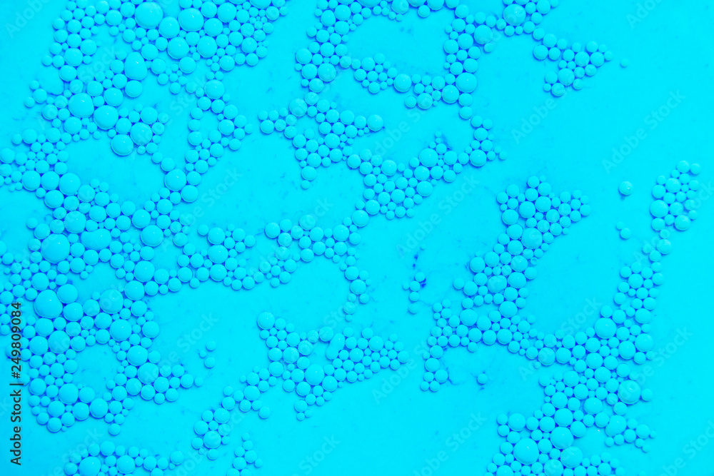 Drops of oil on the surface of the water. Abstract colored background. Drops of oil on the surface of the water. Abstract colored background.