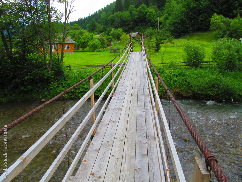 bridge through a mountain river