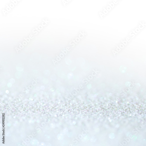 White light glitter magic background. Defocused light and free focused place for your design. © Ulia Koltyrina
