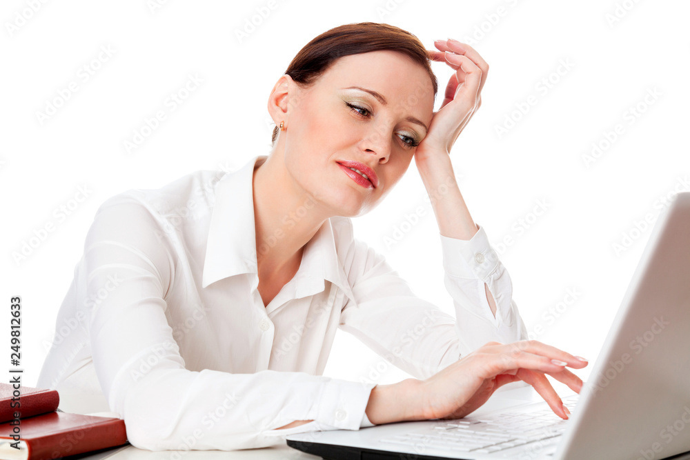 Closeup shot of young student girl working on her laptop computer, isolated on white background Closeup shot of young student girl working on her laptop computer, isolated on white background