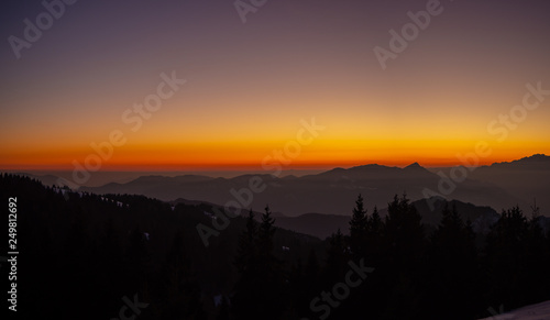 Amazing sunset at Monte Pora ski area in winter season. Landscape to the Italian Alps