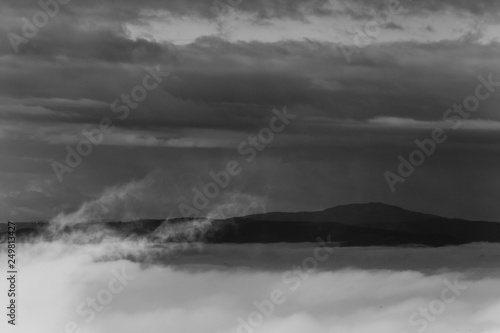 Fog filling a valley in Umbria (Italy), with layers of mountains and hills © Massimo