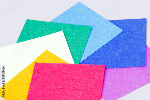 a set of colored sheets of felt, rainbow colors