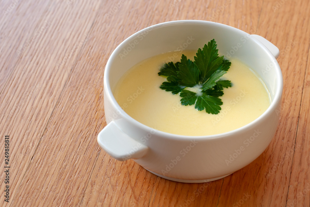 Cheese cream soup with cream, potatoes and spices, decorated with herbs. Cheese cream soup with cream, potatoes and spices, decorated with herbs.