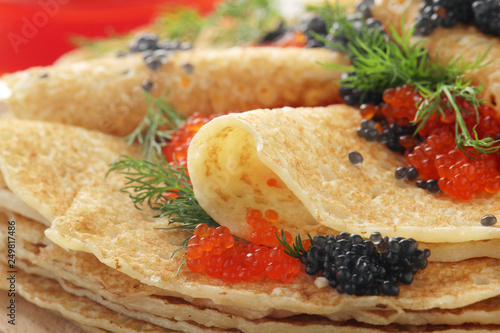 Russian pancakes with red and black caviar 