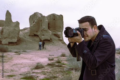 a photographer capturing the moment at Unesco world heritage site in Turkmenistan