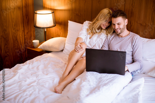 Loving couple surfing inter...