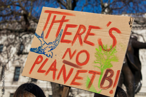 Protestors holding climate change banners at a protest