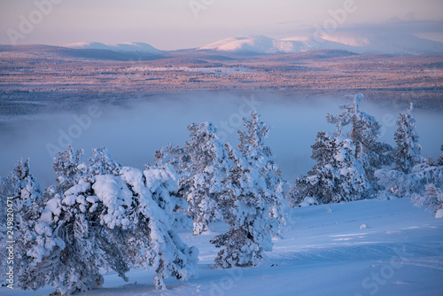 Winter landscape scene in Levi ski resort with Pallas fells in the background in Kittilä, Finland