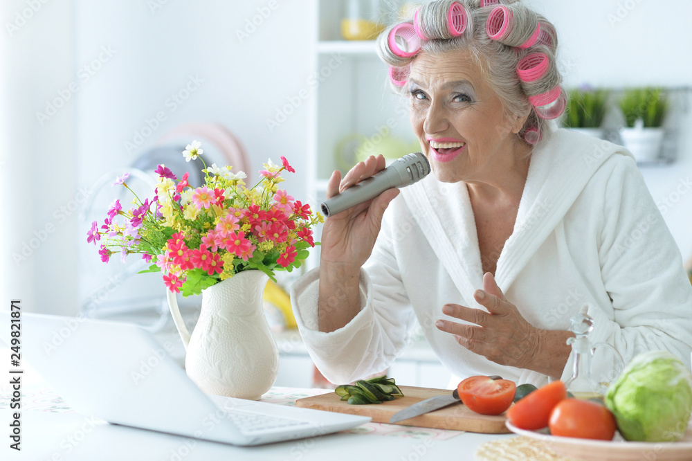 Portrait of senior woman in hair rollers